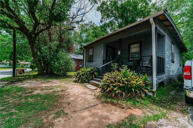 view of home's exterior with covered porch