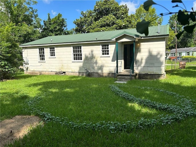 2365 Dog River Dr N, Mobile, AL 36605 - rear view of property with a lawn and a metal roof