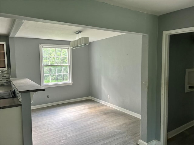 2365 Dog River Dr N, Mobile, AL 36605 - unfurnished dining area featuring wood finished floors and baseboards