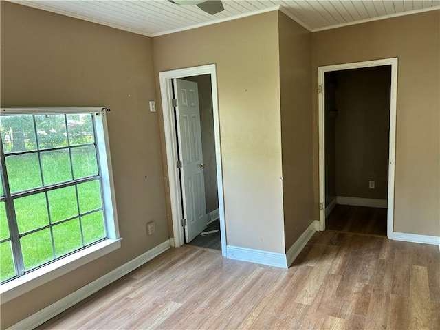 2365 Dog River Dr N, Mobile, AL 36605 - empty room featuring ornamental molding, healthy amount of natural light, light wood-type flooring, and wood ceiling