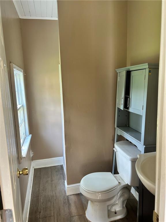 2365 Dog River Dr N, Mobile, AL 36605 - half bathroom with toilet and wood finished floors