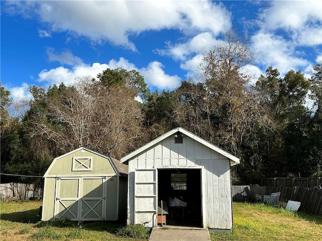 view of outbuilding with a yard