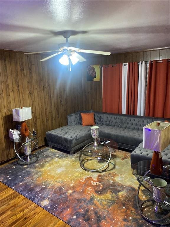 living room featuring wood walls and hardwood / wood-style floors