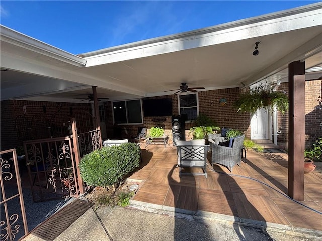 view of patio featuring ceiling fan and covered porch