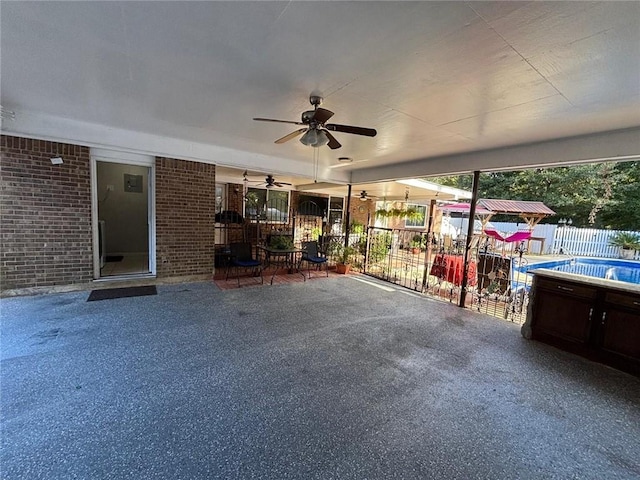 view of patio featuring ceiling fan