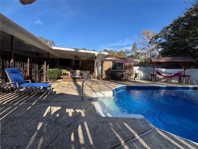 view of pool featuring a patio and ceiling fan