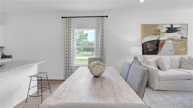 dining space featuring baseboards and recessed lighting