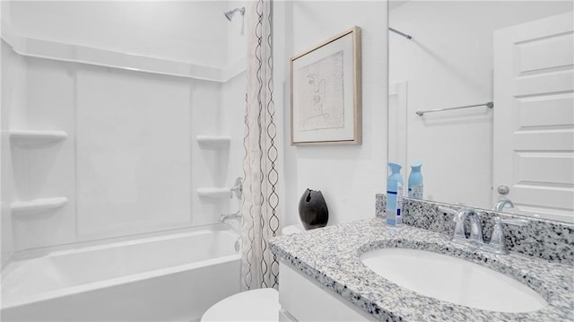 full bath featuring shower / bath combo, vanity, and toilet