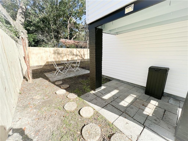 view of yard featuring a patio area and a fenced backyard