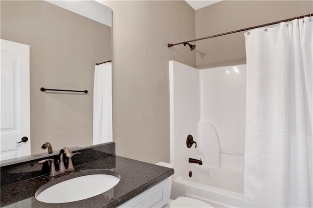 full bathroom featuring vanity, toilet, and shower / tub combo