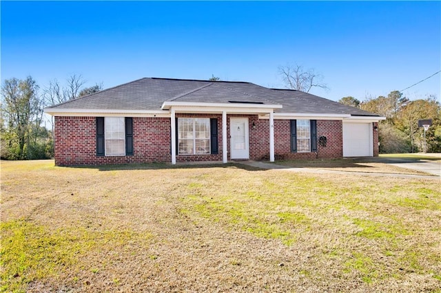 ranch-style home with a garage and a front lawn