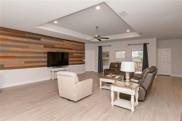 12927 Sanderling Loop, Daphne, AL 36527 - living room with a raised ceiling, light wood-type flooring, ceiling fan, wood walls, and recessed lighting