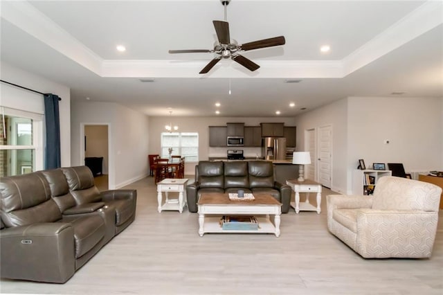 12927 Sanderling Loop, Daphne, AL 36527 - living room with a raised ceiling, healthy amount of natural light, ceiling fan, recessed lighting, and ornamental molding