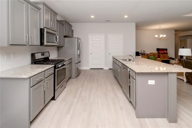 12927 Sanderling Loop, Daphne, AL 36527 - kitchen featuring stainless steel appliances, gray cabinetry, light wood-type flooring, and recessed lighting