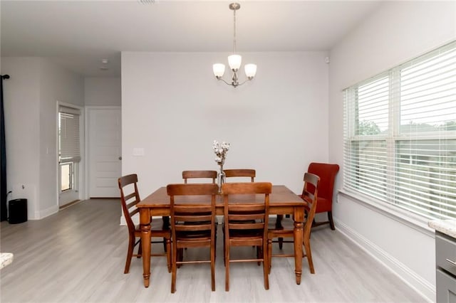 12927 Sanderling Loop, Daphne, AL 36527 - dining area with a chandelier and light wood finished floors