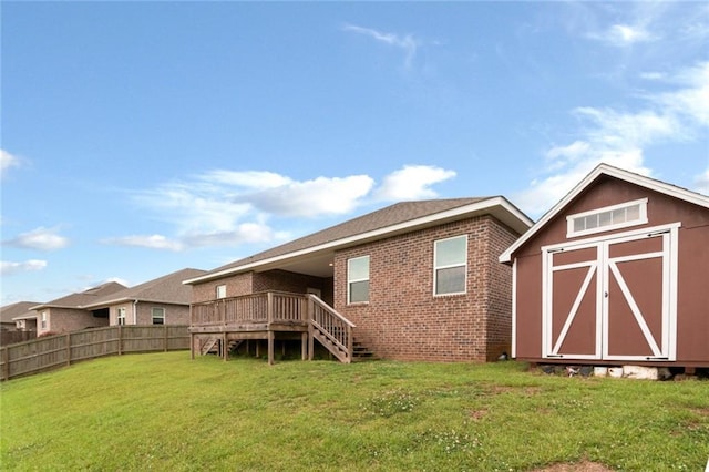 12927 Sanderling Loop, Daphne, AL 36527 - back of property with stairway, a storage unit, a wooden deck, and brick siding