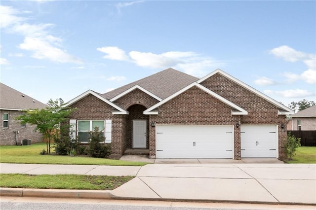 12927 Sanderling Loop, Daphne, AL 36527 - view of front of house featuring brick siding, a garage, concrete driveway, and a front yard