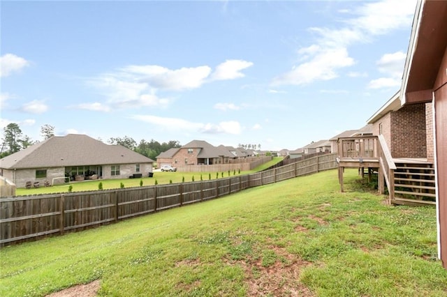 12927 Sanderling Loop, Daphne, AL 36527 - fenced backyard with a wooden deck, stairway, and a residential view