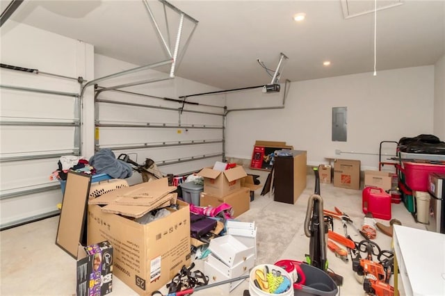 12927 Sanderling Loop, Daphne, AL 36527 - garage featuring a garage door opener, electric panel, and recessed lighting