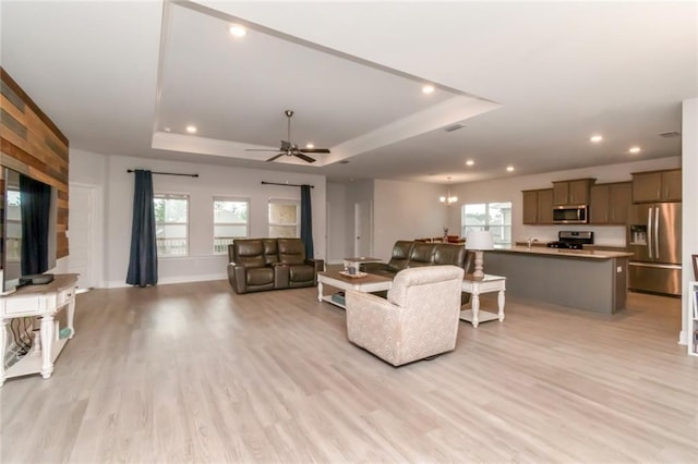 12927 Sanderling Loop, Daphne, AL 36527 - living area featuring a tray ceiling, light wood finished floors, ceiling fan, and recessed lighting