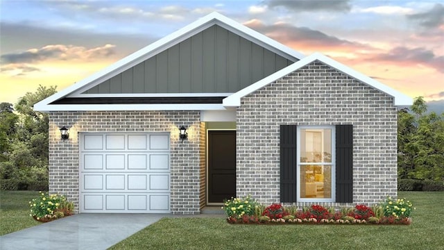 view of front of home with a garage and a yard