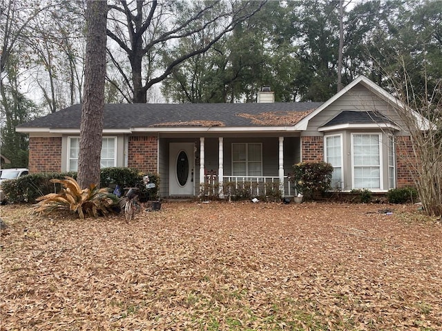 ranch-style home featuring covered porch