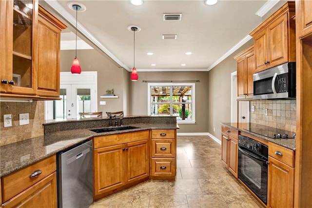 3245 Mcrae Dr, Mobile, AL 36695 - kitchen with black appliances, a peninsula, brown cabinets, dark stone counters, and crown molding