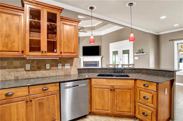 3245 Mcrae Dr, Mobile, AL 36695 - kitchen with stainless steel dishwasher, brown cabinetry, a peninsula, dark stone counters, and crown molding