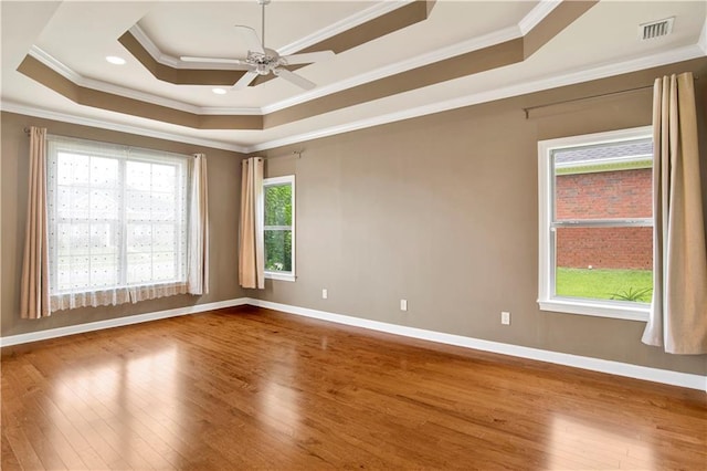 3245 Mcrae Dr, Mobile, AL 36695 - unfurnished room with wood-type flooring, crown molding, a tray ceiling, and ceiling fan