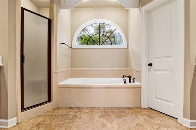 3245 Mcrae Dr, Mobile, AL 36695 - bathroom with a stall shower, a garden tub, and tile patterned flooring