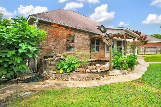 3245 Mcrae Dr, Mobile, AL 36695 - rear view of property with brick siding and roof with shingles