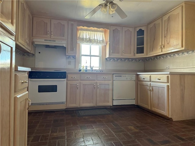 kitchen featuring white appliances, tasteful backsplash, light brown cabinetry, sink, and ceiling fan