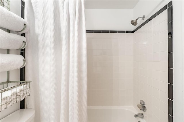 full bathroom with toilet and shower / bathtub combination with curtain