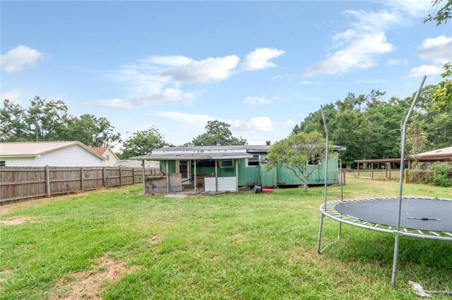 view of yard featuring a trampoline