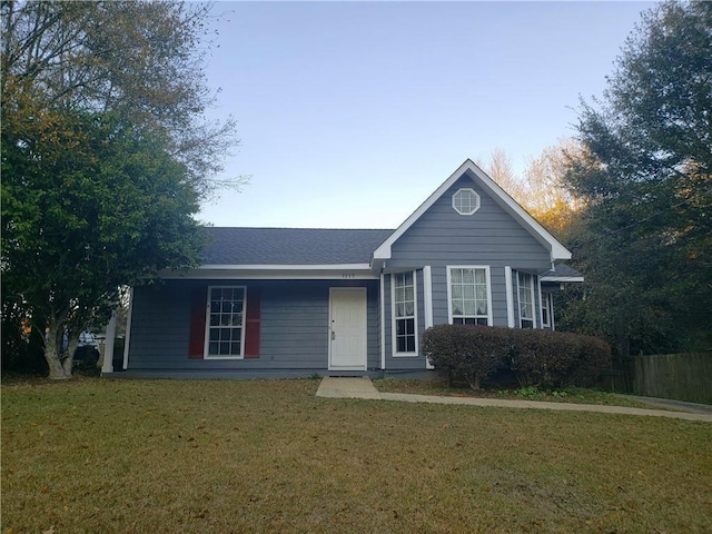 ranch-style home featuring a front yard