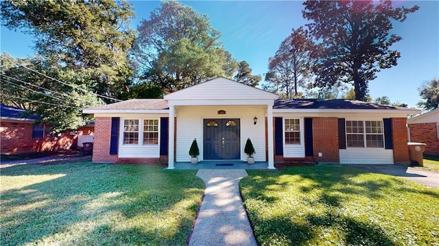 single story home with a front lawn and a porch