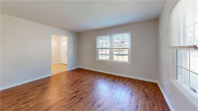 spare room with hardwood / wood-style floors