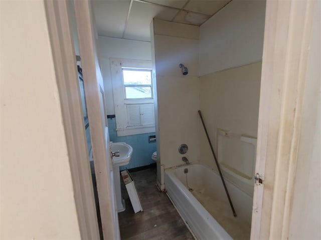 bathroom with toilet, shower / bath combination, and hardwood / wood-style floors