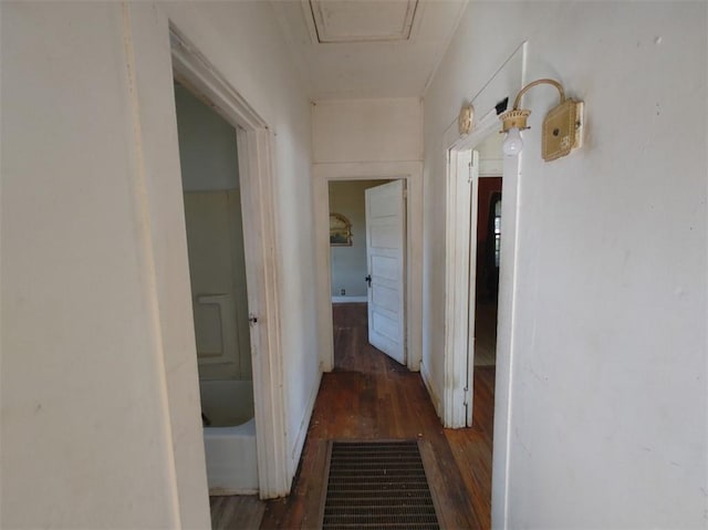 hallway with dark hardwood / wood-style floors