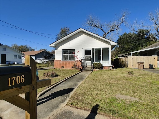 bungalow-style house with a front yard