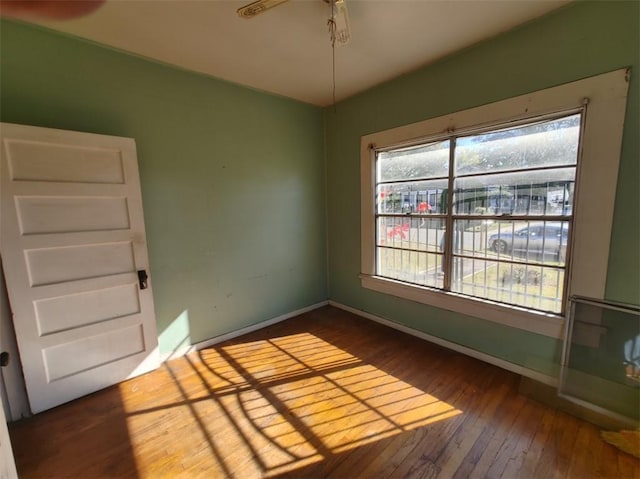 spare room with hardwood / wood-style flooring