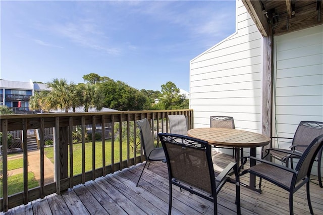 50 Forney Johnston Dr Unit 8B, Dauphin Island, AL 36528 - deck with outdoor dining area and a lawn