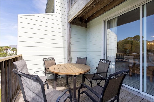50 Forney Johnston Dr Unit 8B, Dauphin Island, AL 36528 - view of wooden balcony with outdoor dining space and a wooden deck