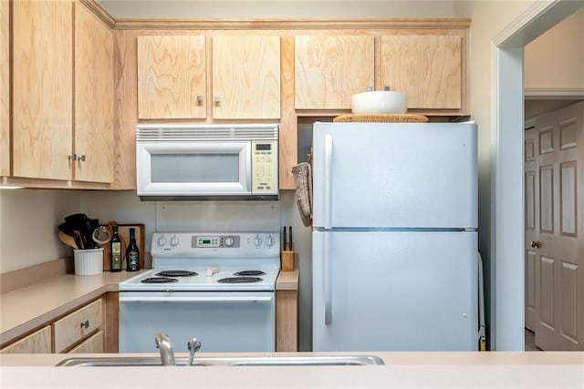 50 Forney Johnston Dr Unit 8B, Dauphin Island, AL 36528 - kitchen featuring white appliances, light brown cabinets, and light countertops