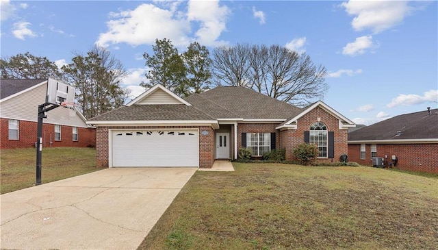 single story home with a front yard, brick siding, driveway, and an attached garage