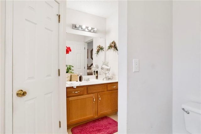 half bath with toilet and vanity