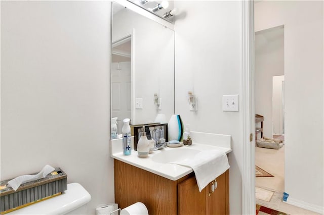 bathroom featuring toilet and vanity