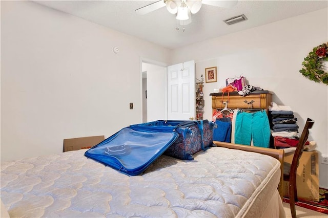 bedroom with a ceiling fan and visible vents