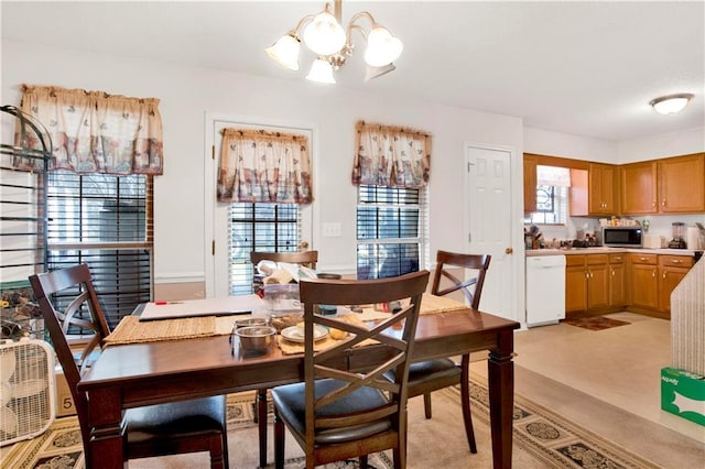 dining area with a notable chandelier and a healthy amount of sunlight