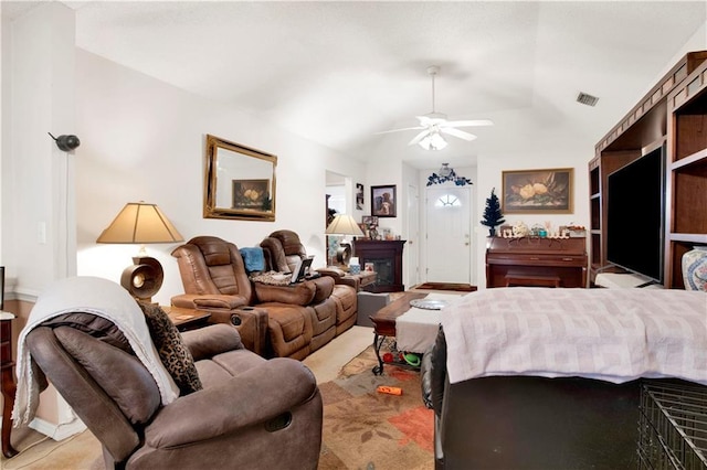 bedroom with visible vents, a fireplace, a ceiling fan, and vaulted ceiling